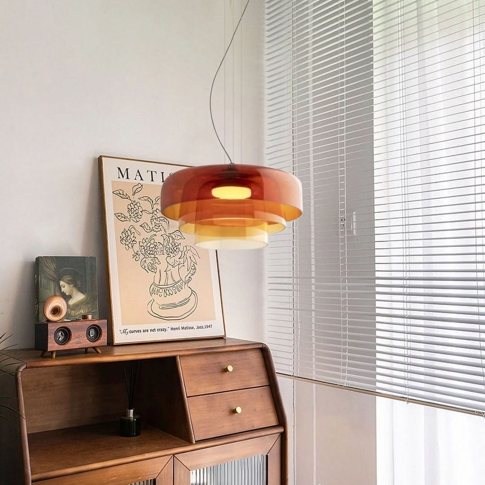 Aurora glasophængt lampe med unikt metal- og glasvedhængsdesign til moderne interiører
