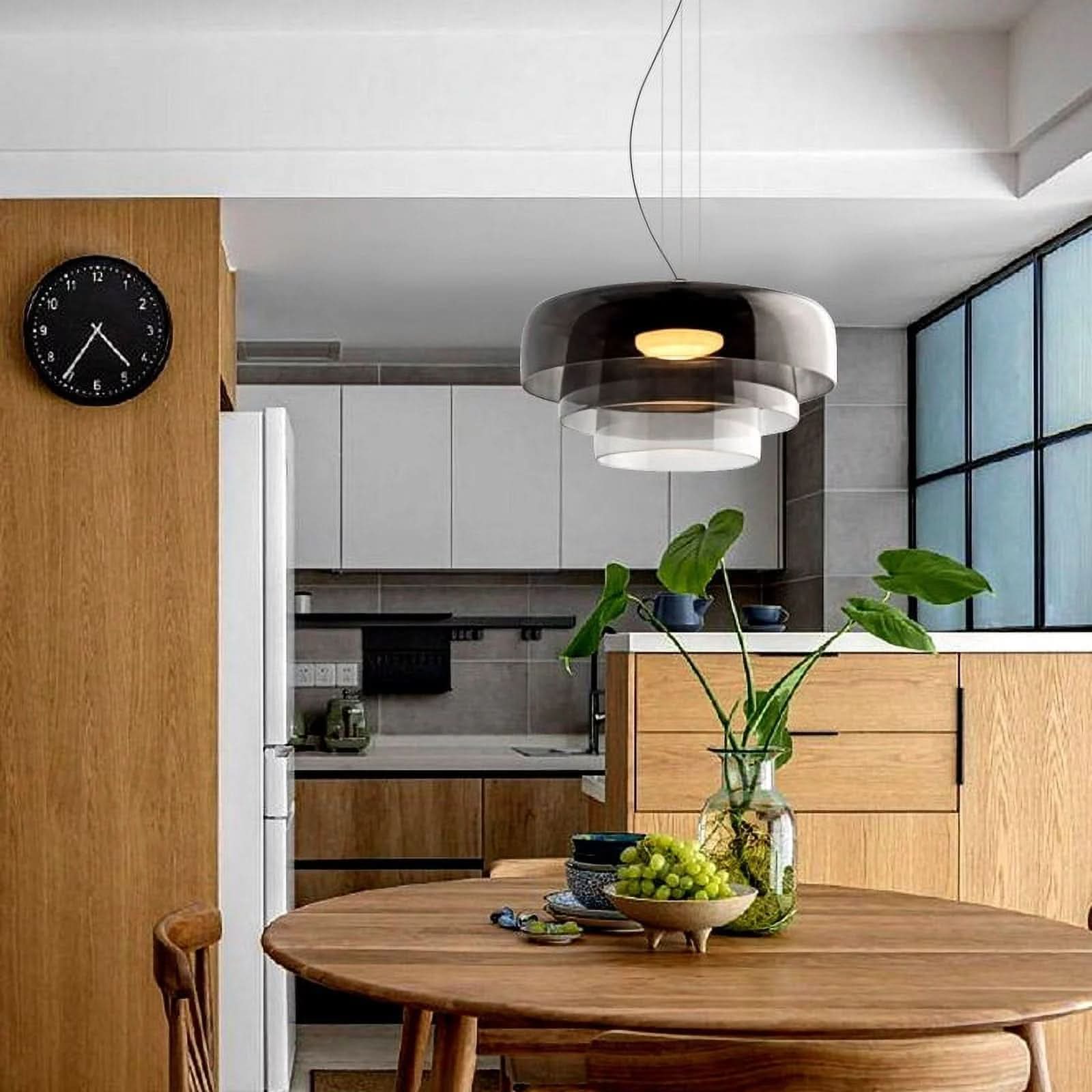Aurora glasophængt lampe med unikt metal- og glasvedhængsdesign til moderne interiører
